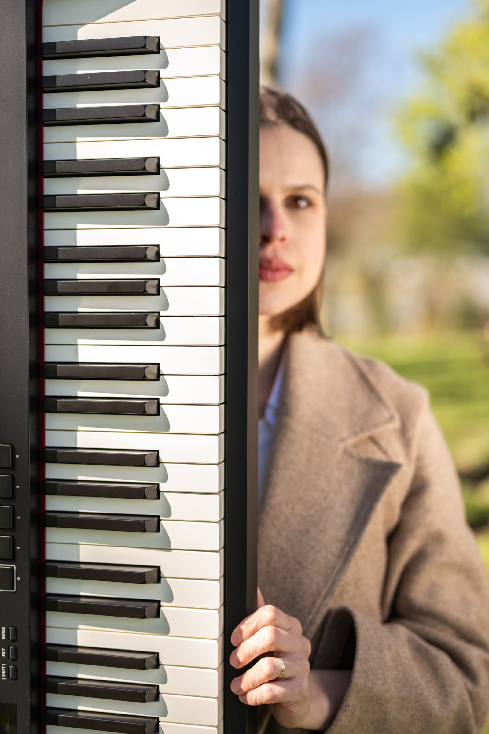Nicoli Uzun at the piano with a student